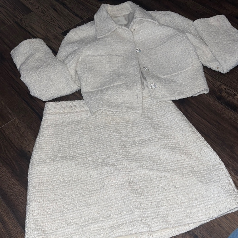 Tweed skirt set with rhinestone buttons on jacket